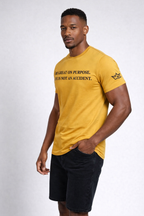 Unisex gold edition T-shirt by CIM Designs with "Be Great On Purpose" printed design on front.